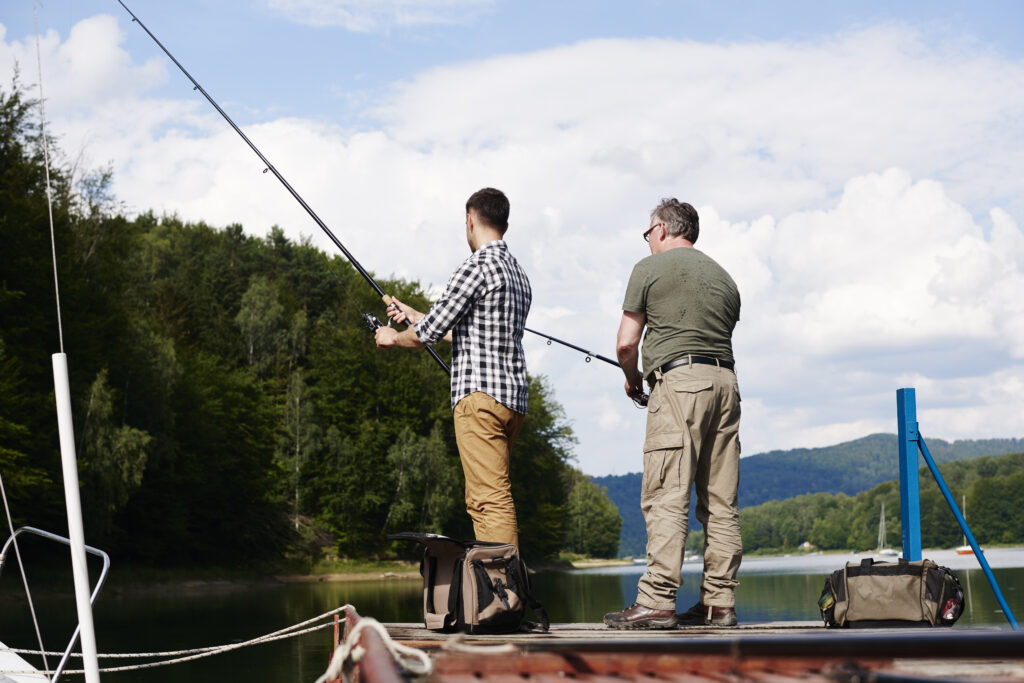 rear view of men fishing